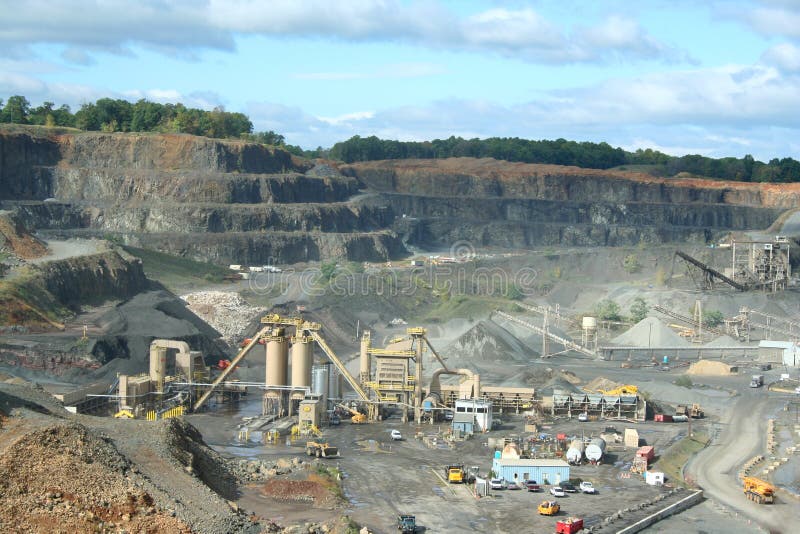 Dump Trucks Lined Up at a Rock Quarry Stock Photo Image of loader