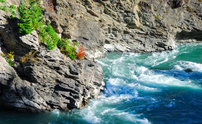 Rock with rapid, Paradise places in Sount New Zealand stock images Rock with rapid, Paradise places in Sount New Zealand stock images