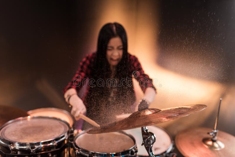 Rock and Roll Girl Playing Hard Rock Music with Drums Set Stock Image