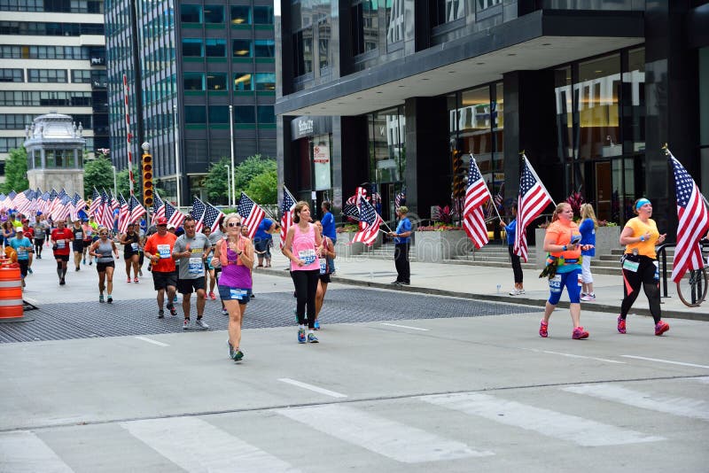 Chicago, Illinois - July 16, 2017: Participants in the Rock and roll Chicago Half Marathon run along Loop. Chicago, Illinois - July 16, 2017: Participants in the Rock and roll Chicago Half Marathon run along Loop.