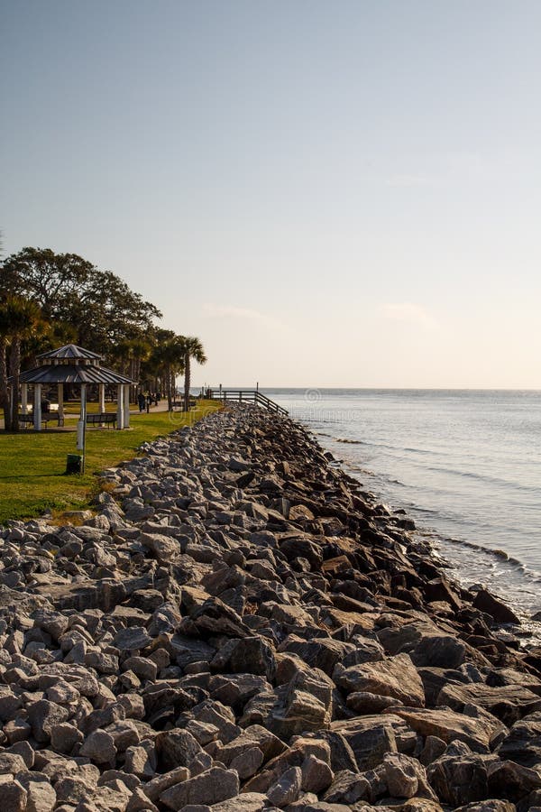 Rock Seawall between Ocean and Park Stock Image Image of stone