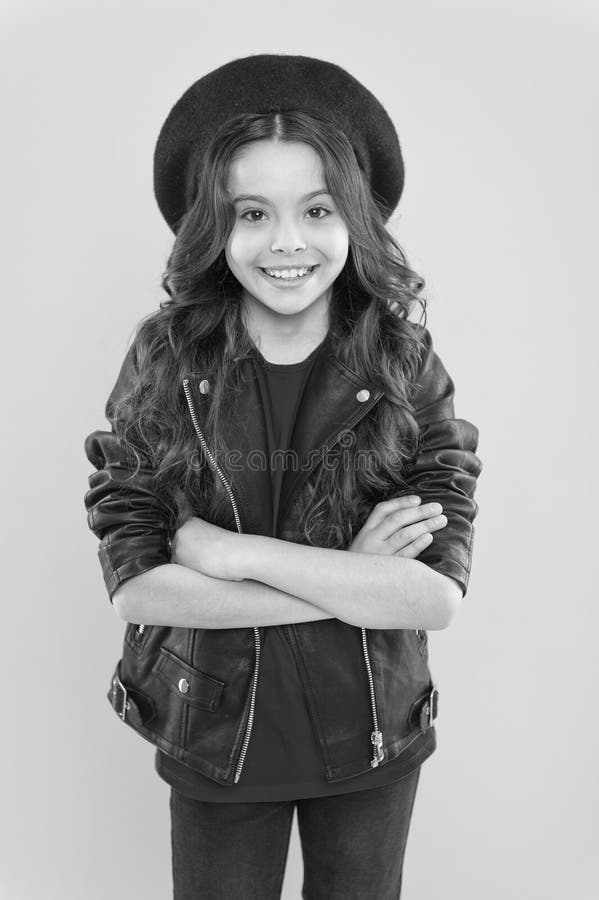 Rock style suits her. Rock and roll is way of life. Outfit ideas every stylish girl should try. Girl curly hair wear royalty free stock photos Rock style suits her. Rock and roll is way of life. Outfit ideas every stylish girl should try. Girl curly hair wear royalty free stock photos
