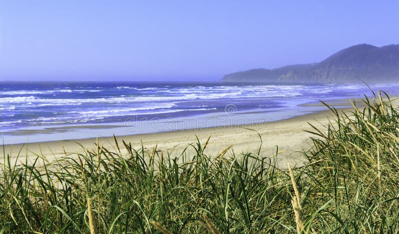 Rockaway Beach Oregon on a sunny day. View from back deck of a bungalow right on the beach. Rockaway Beach Oregon on a sunny day. View from back deck of a bungalow right on the beach.