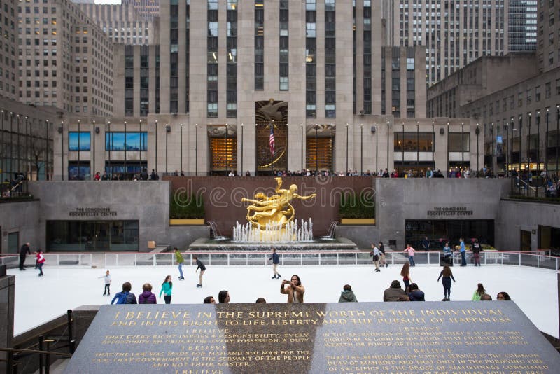Skaters at the Rockefeller Centre in New York city with Prometheus statue centre of the image. Skaters at the Rockefeller Centre in New York city with Prometheus statue centre of the image