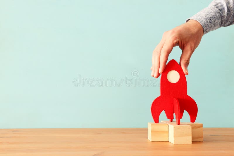Rocket leadership concept. red rocket as leader of the group. idea of standing out of the crowd stock photos