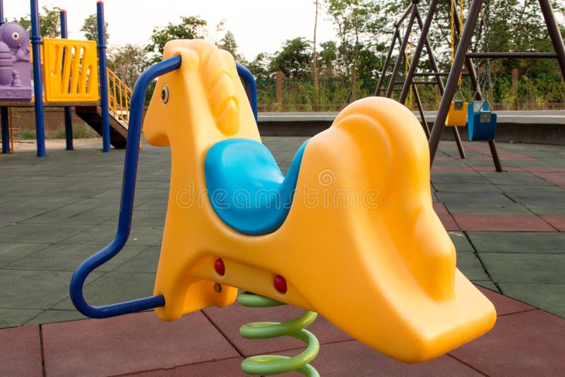 Rocking horse in the park stock image. Image of color 71329201