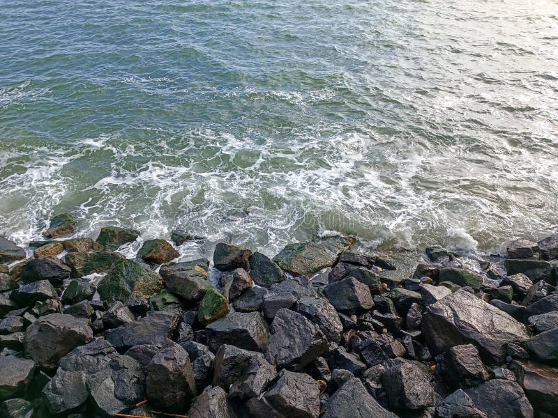 rocks on the beach with cloudy sky. rocks on the beach with cloudy sky