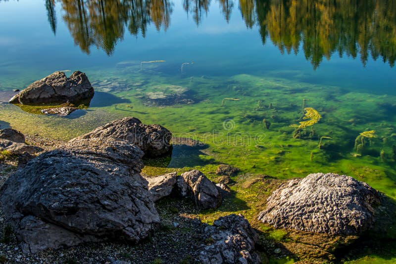 Rocks With Green Water Of Mountain Lake At Seven Lakes Valley Bohinj