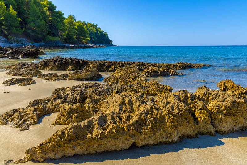 Rocks on the sand beach on Peljesac peninsula near Zuljana, Adriatic Sea