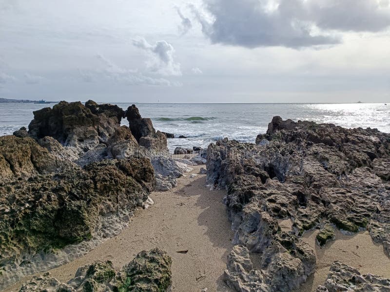 rocks on the beach with cloudy sky. rocks on the beach with cloudy sky