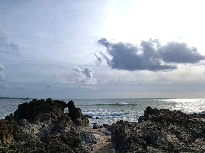 rocks on the beach with cloudy sky. rocks on the beach with cloudy sky