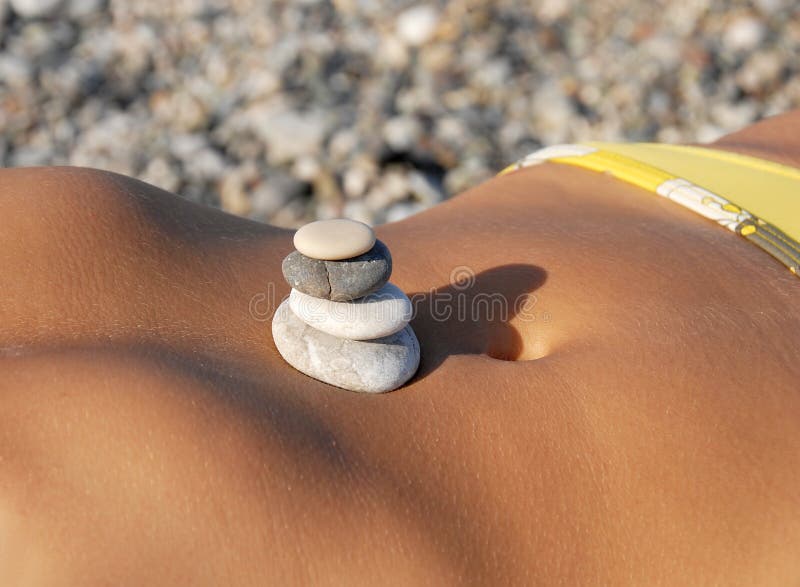 Rocks stack on stomach