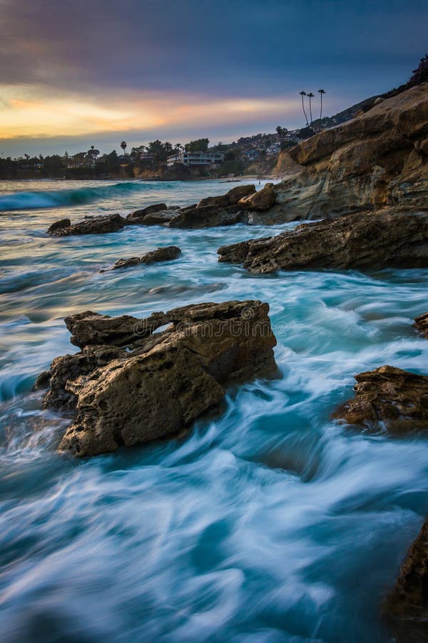 Rocks and waves in the Pacific Ocean at sunset