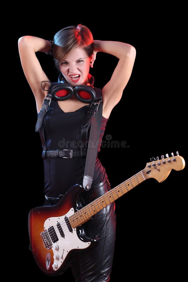 Rockstar, der ihre E-Gitarre hält Reizvolles Mädchen stockfoto Rockstar, der ihre E-Gitarre hält Reizvolles Mädchen stockfoto
