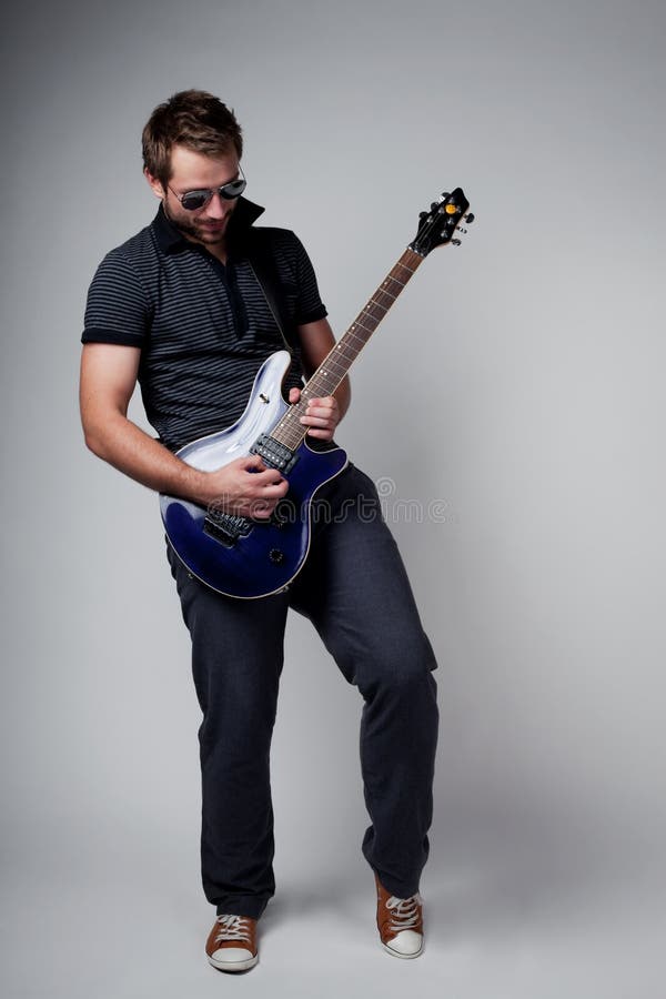 Rockstar guitar player stock image. Image of guitar, performance 25470459