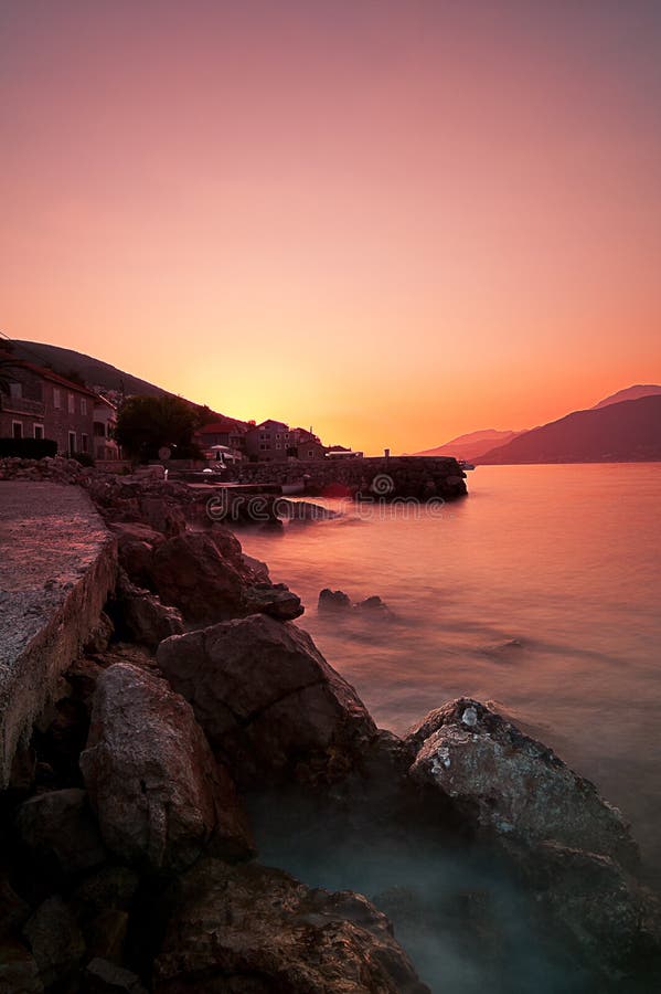 Rocky beach and sunset at Adriatic sea coast