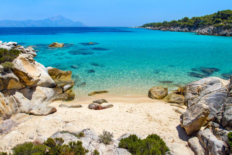 Rocky cliff above the beautiful clear water