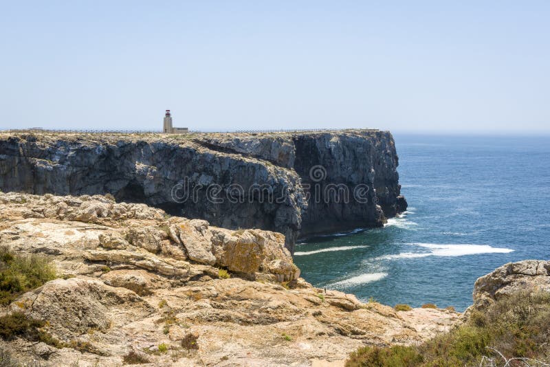 Rocky coastline and lighthouse in Sagres, Portugal