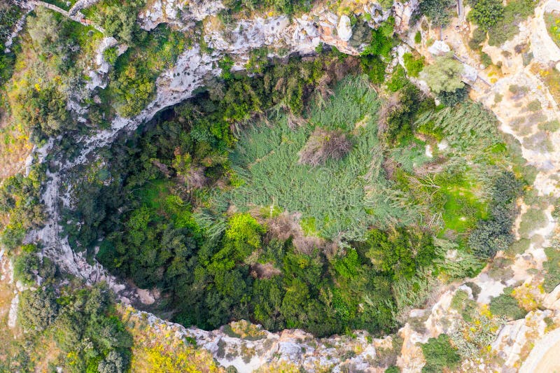 Rocky gorge in the form of an egg overgrown with vegetation, top aerial view royalty free stock photos Rocky gorge in the form of an egg overgrown with vegetation, top aerial view royalty free stock photos