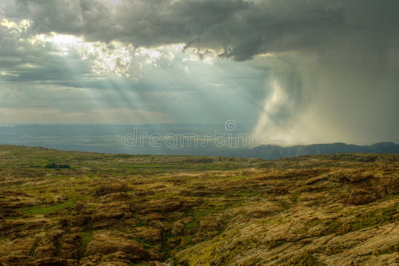 Rocky hill with heavy storm