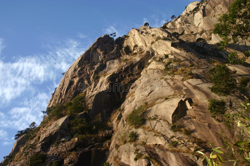 Rocky mountainside stock image. Image of face, blue, rocky 4354395