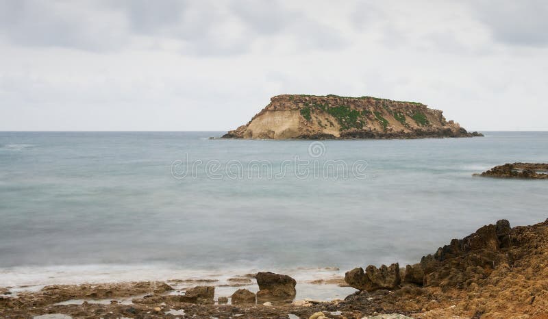 Rocky Seascape with the island of geronisos Paphos, Cyprus