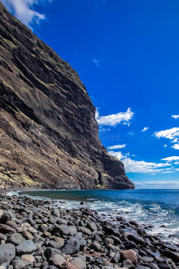 Rocky cape protrudes into the sea, ocean coast, pebbles, seascape, good weather stock photos Rocky cape protrudes into the sea, ocean coast, pebbles, seascape, good weather stock photos