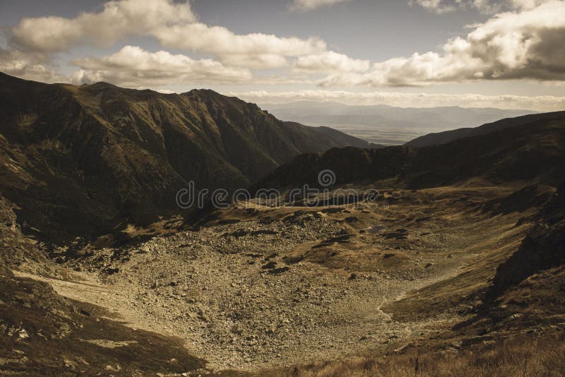 Rocky Tatra mountain tourist hiking trails under blue sky in Slovakia - vintage retro look