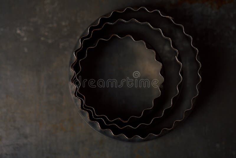 Vintage Baking Tin cutters on metal backdrop , tiny focus. Vintage Baking Tin cutters on metal backdrop , tiny focus