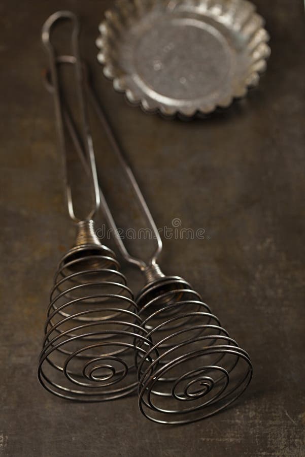 Vintage Baking Tin whisks and mould in dark light. Vintage Baking Tin whisks and mould in dark light