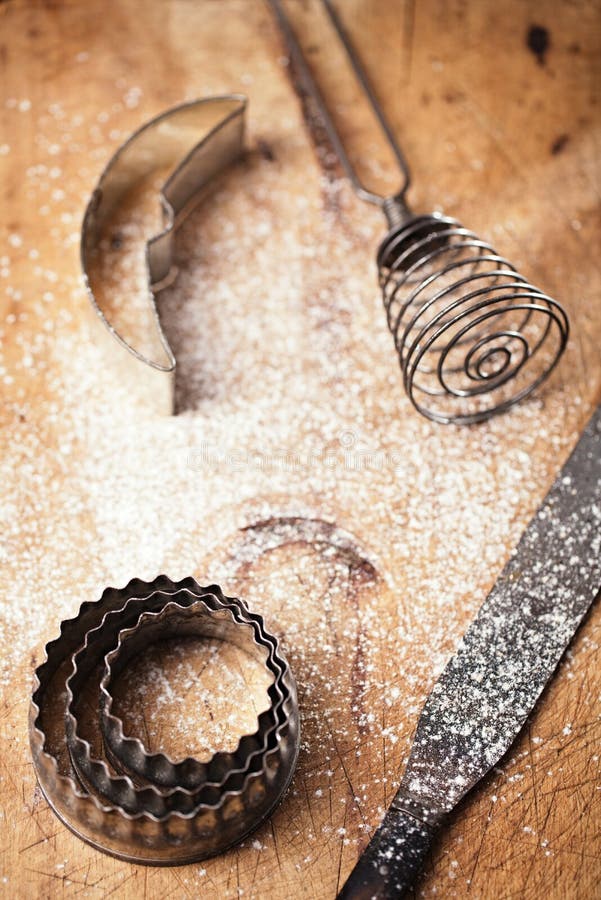 Abstract picture with Vintage Baking utensils and flour on wooden backdrop. Abstract picture with Vintage Baking utensils and flour on wooden backdrop