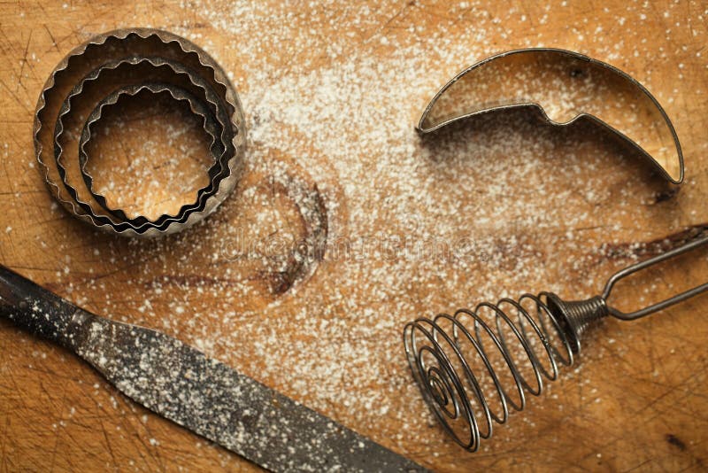 Abstract picture with Vintage Baking utensils and flour on wooden backdrop. Abstract picture with Vintage Baking utensils and flour on wooden backdrop