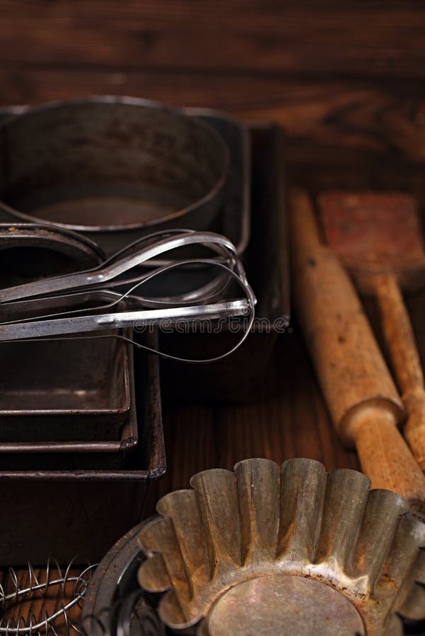 Vintage Baking Tins and tools on wooden background. Vintage Baking Tins and tools on wooden background