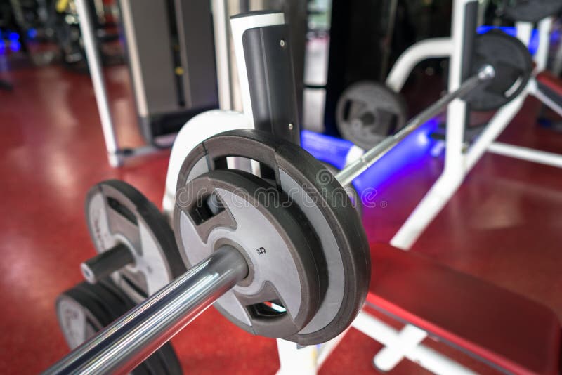 Rod and weights in the gym stock photos Rod and weights in the gym stock photos