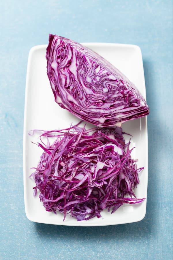 Shredded red cabbage on white plate. Shredded red cabbage on white plate