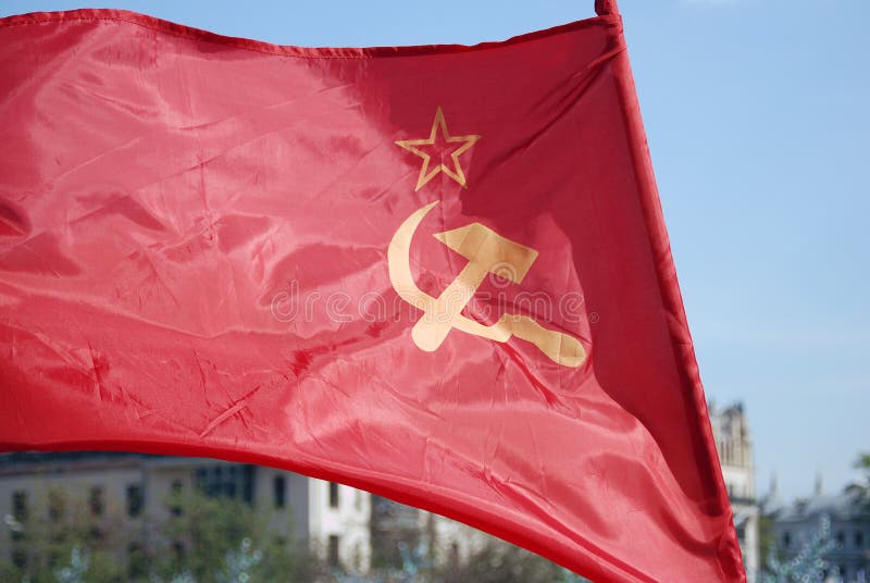Red flag with a star, hammer and sickle. Holiday decoration on the Theatre Square, by the Bolshoi Theater. Victory Day celebration on May 09, 2013 in Moscow. Red flag with a star, hammer and sickle. Holiday decoration on the Theatre Square, by the Bolshoi Theater. Victory Day celebration on May 09, 2013 in Moscow.