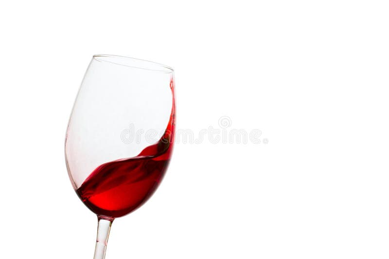 Red wine splashing gracefully in a tilted glass on a white background sweet and appetizing alcoholic drink made from grapes. Red wine splashing gracefully in a tilted glass on a white background sweet and appetizing alcoholic drink made from grapes