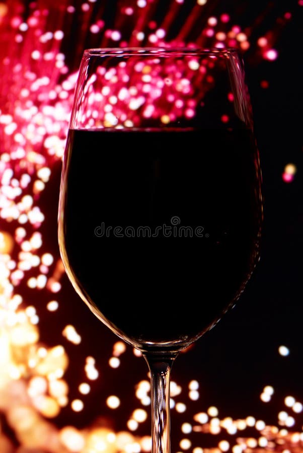 Red wine glass on a bright background. Red wine glass on a bright background