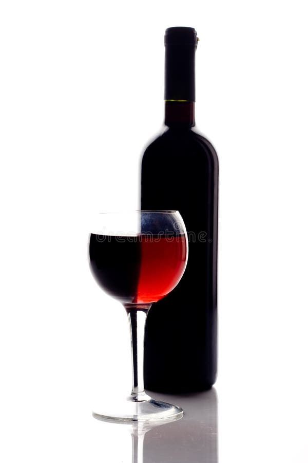 Red wine glass and wine bottle. Red wine glass and wine bottle