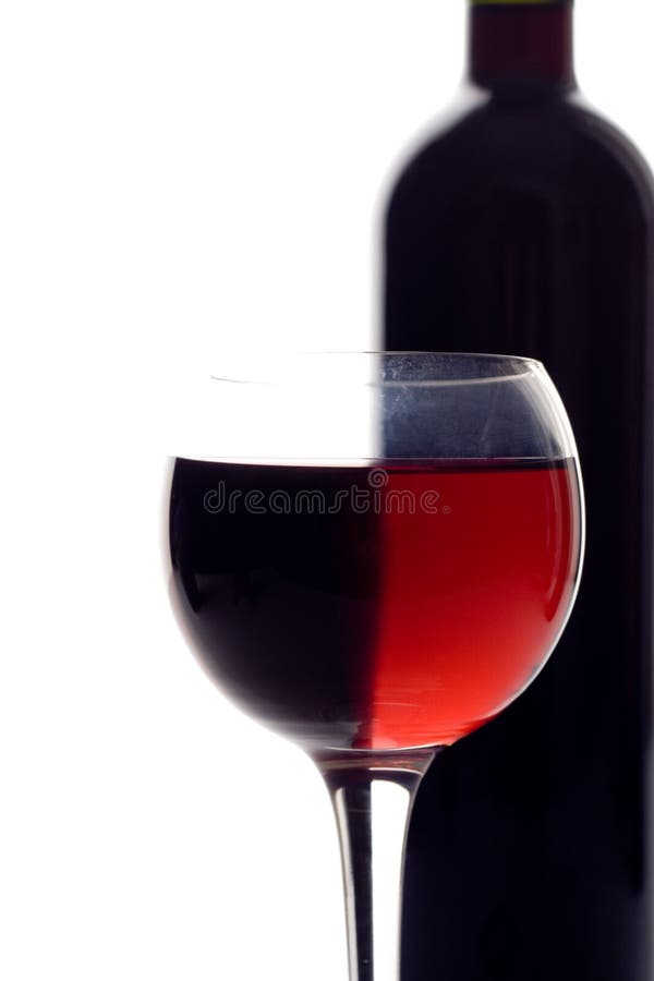 Red wine glass and wine bottle. Red wine glass and wine bottle