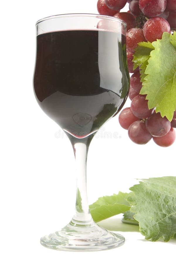 Red wine glass with red grape background. Red wine glass with red grape background