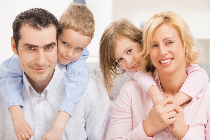 Closeup portrait of happy family, children embracing their parents. Closeup portrait of happy family, children embracing their parents.