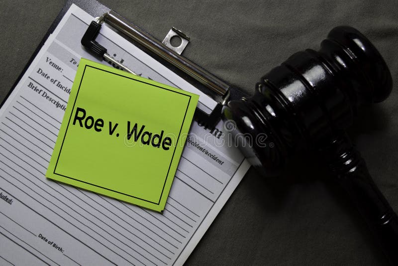 Roe v. Wade on sticky notes and gavel isolated on office desk. Law concept