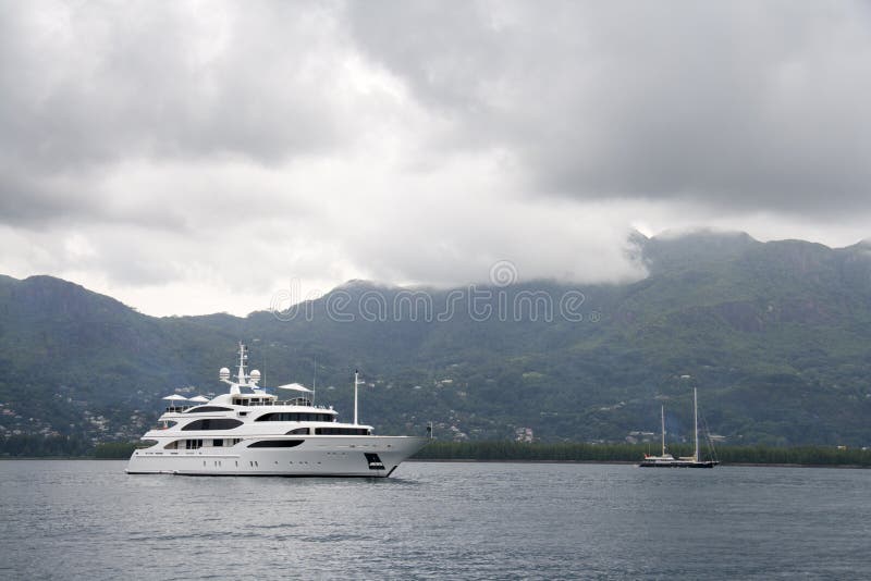 Large recreational yacht and a sailboat near Mahe Island in Seychelles. Large recreational yacht and a sailboat near Mahe Island in Seychelles
