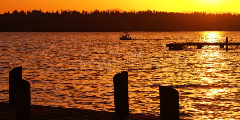 A boat passes by the docks at Marina Park in Kirkland, Washington. A boat passes by the docks at Marina Park in Kirkland, Washington.