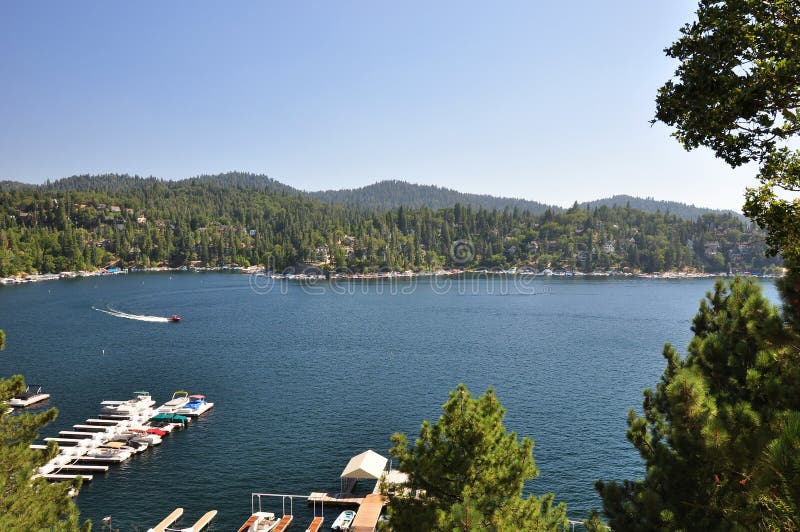 A speed boat makes its way across Lake Arrowhead in the San Bernardino mountains. A speed boat makes its way across Lake Arrowhead in the San Bernardino mountains.