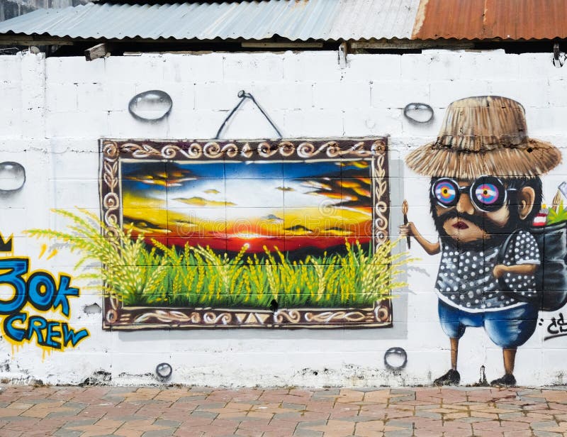 Roiet, Tailândia - 29 de agosto de 2017: Povos que visitam a arte da rua da cidade de Roiet, lugar criados arte dos grafittis em imagem de stock royalty free Roiet, Tailândia - 29 de agosto de 2017: Povos que visitam a arte da rua da cidade de Roiet, lugar criados arte dos grafittis em imagem de stock royalty free