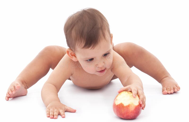 Funny baby playing with an apple. Isolated on a white background. Funny baby playing with an apple. Isolated on a white background.