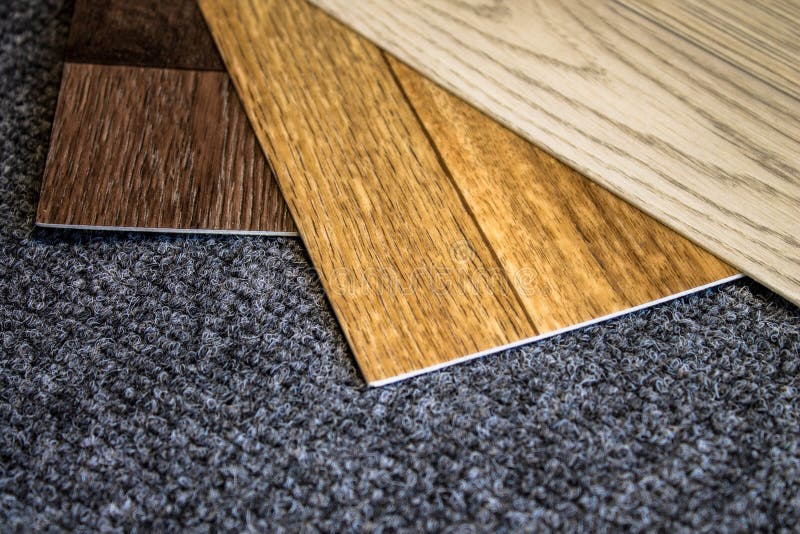 Grey roll of carpet and a knife for slicing royalty free stock photo