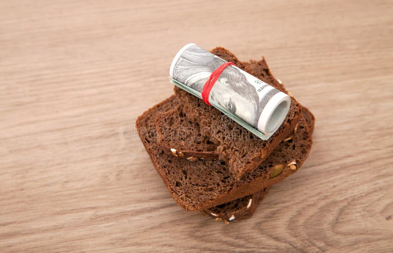 A Roll of Dollar Bills and Black Bread Stock Photo Image of filling